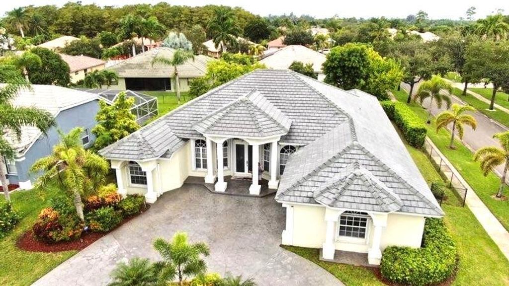 Photo of 113 Sugarwood Crescent, Royal Palm Beach, FL 33411 (MLS # R11148830)