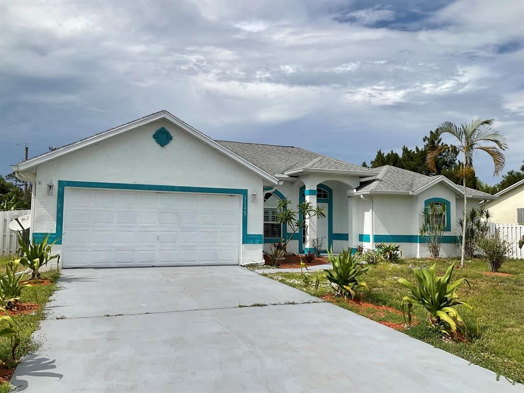 Photo of 1117 SW Sudder Avenue, Port Saint Lucie, FL 34953 (MLS # R10798279)