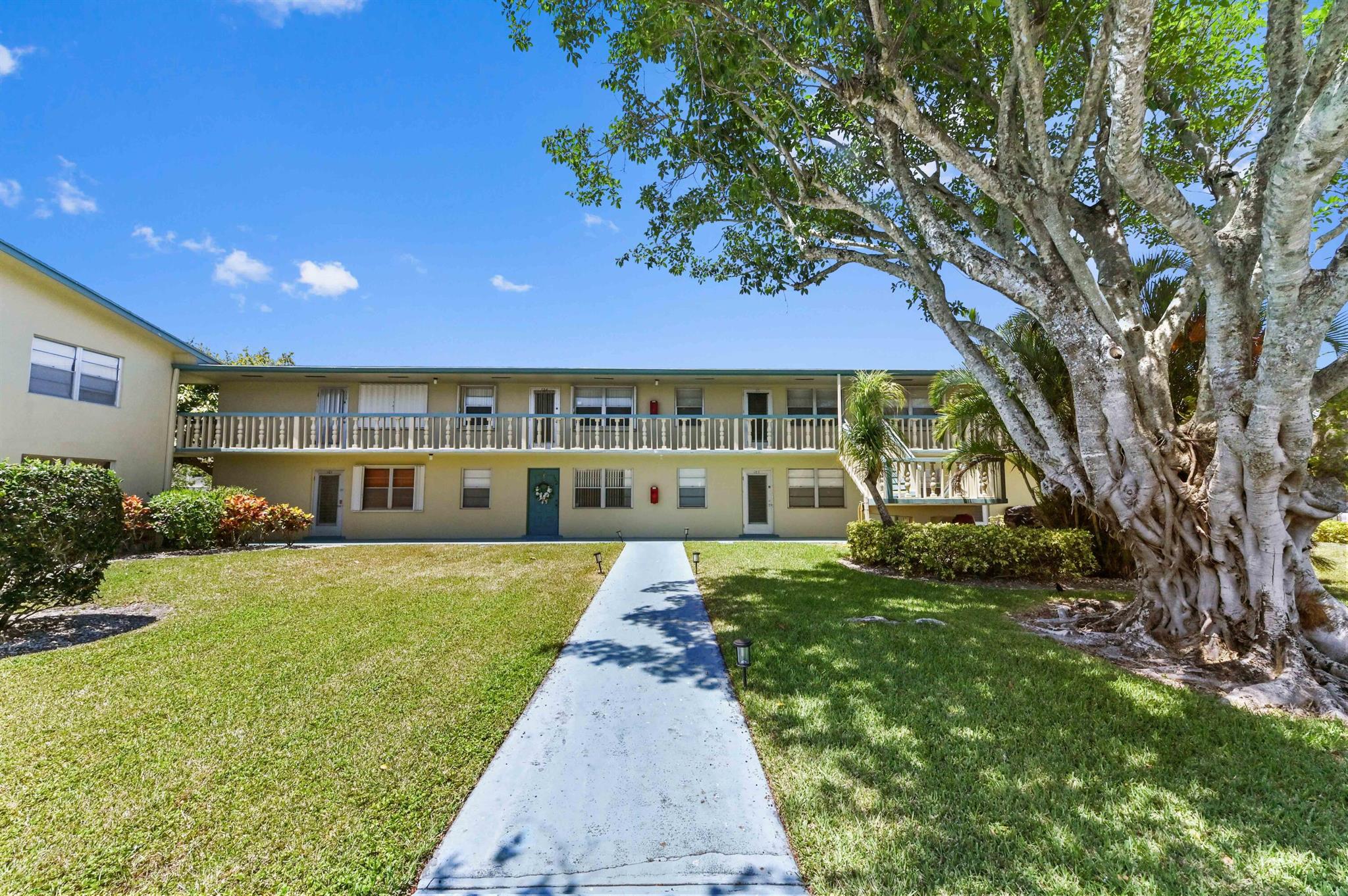 Welcome to this cozy and charming 1-bedroom, 1-bathroom condo nestled in the heart of Century Village, a vibrant 55+ community in West Palm Beach. Located on the second floor, this home features neutral tile flooring throughout, two A/C wall units, a ceiling fan for added comfort, and a wall-to-wall mirrored closet in the spacious bedroom. Step out onto your private screened patio and enjoy your morning coffee with peaceful views, just steps away from one of the many community pools.