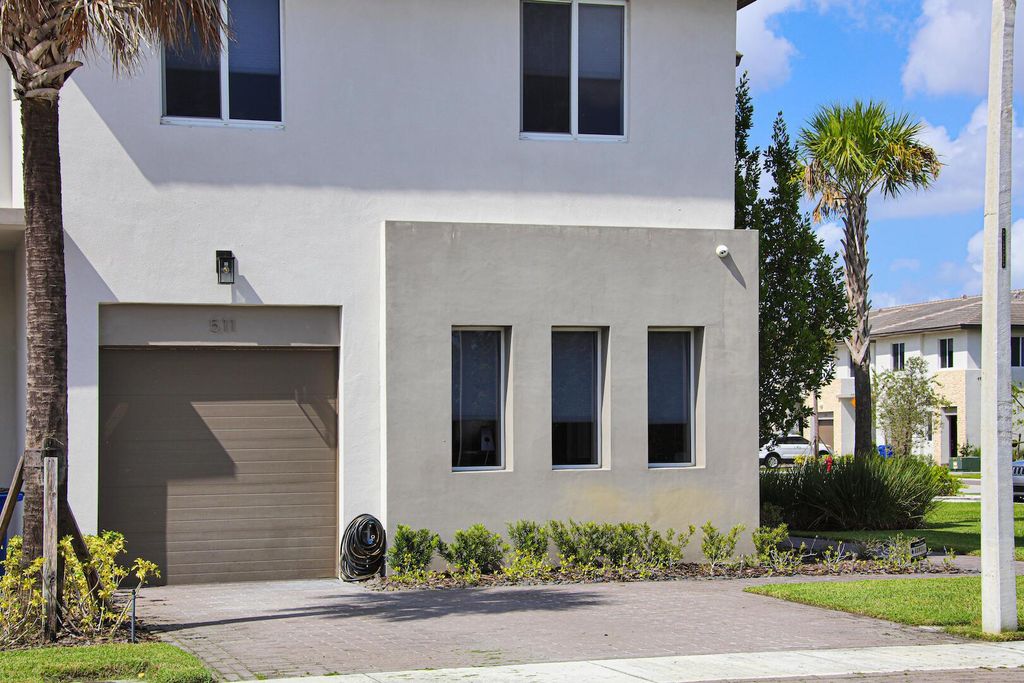 Photo of 511 Pioneer Way, Royal Palm Beach, FL 33411 (MLS # R11048536)