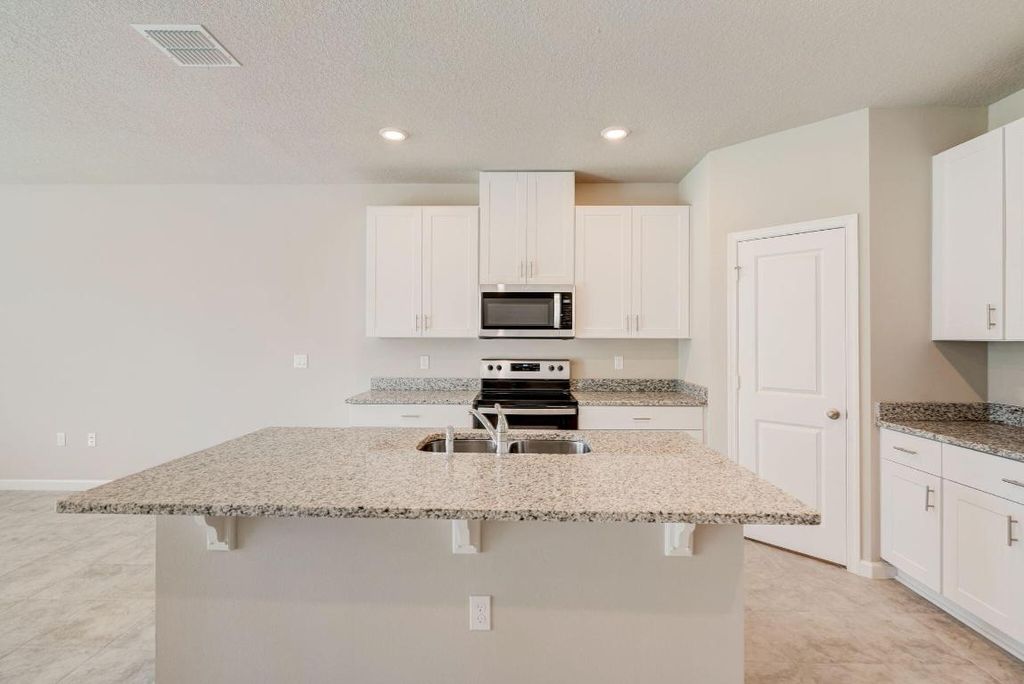 Photo of 5720 SE Edgewater Circle, Stuart, FL 34997 (MLS # R10985580)