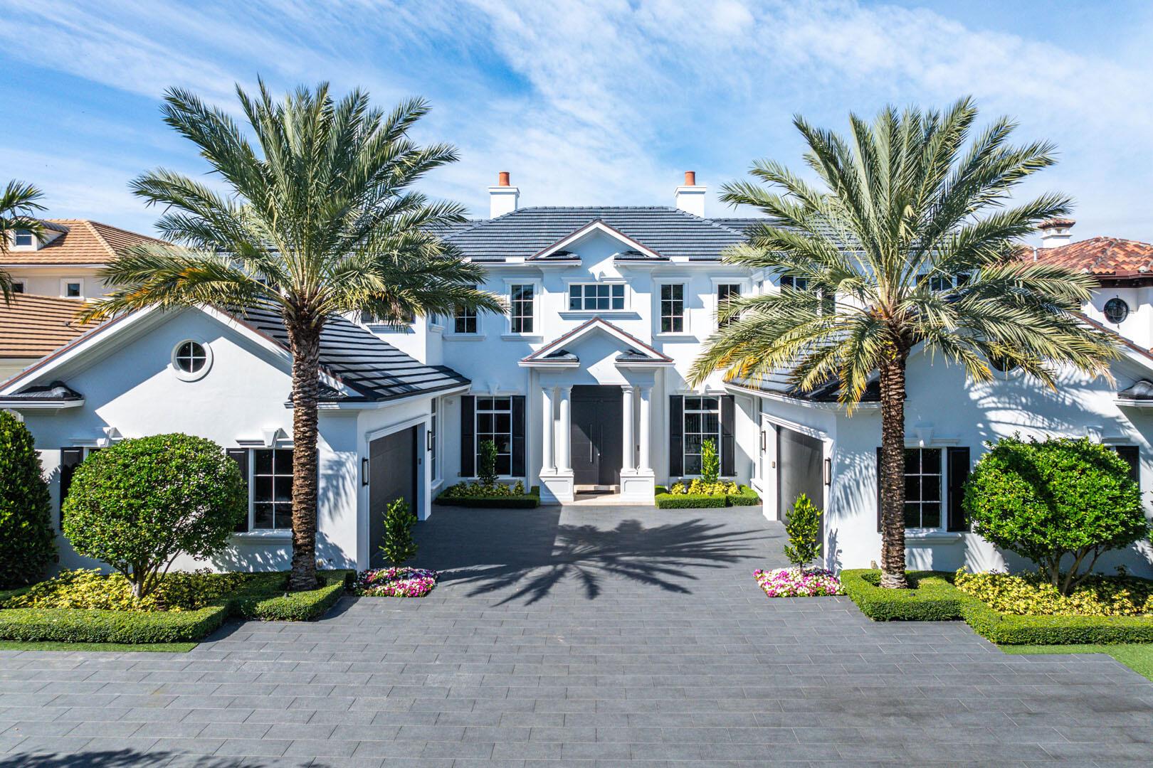 An extraordinary offering in Royal Palm Yacht & Country Club, 311 Key Palm Road is a distinguished waterfront estate that masterfully blends enduring architectural elegance with contemporary refinement. Positioned on an oversized lot with sweeping vistas of the Fishtail Palm Waterway, this residence spans over 9,000 square feet of meticulously curated living space. Every detail reflects an uncompromising commitment to quality--rich hardwood flooring, artisanal wainscoting, designer slab walls, and bespoke millwork create an atmosphere of understated grandeur. The gourmet kitchen features handcrafted cabinetry, dual islands, seamlessly integrated appliances, and a discreetly concealed pantry.