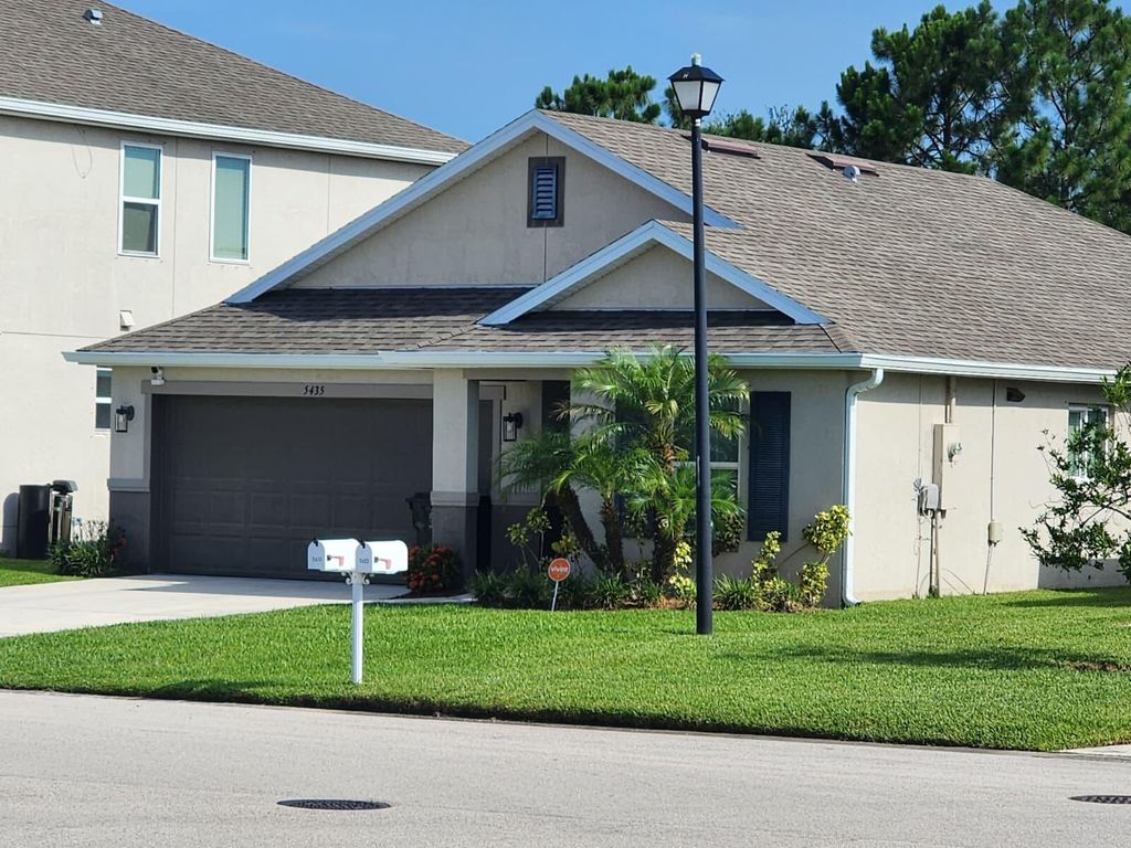Photo of 5435 NW Pine Trail Circle, Port Saint Lucie, FL 34983 (MLS # B26046302)