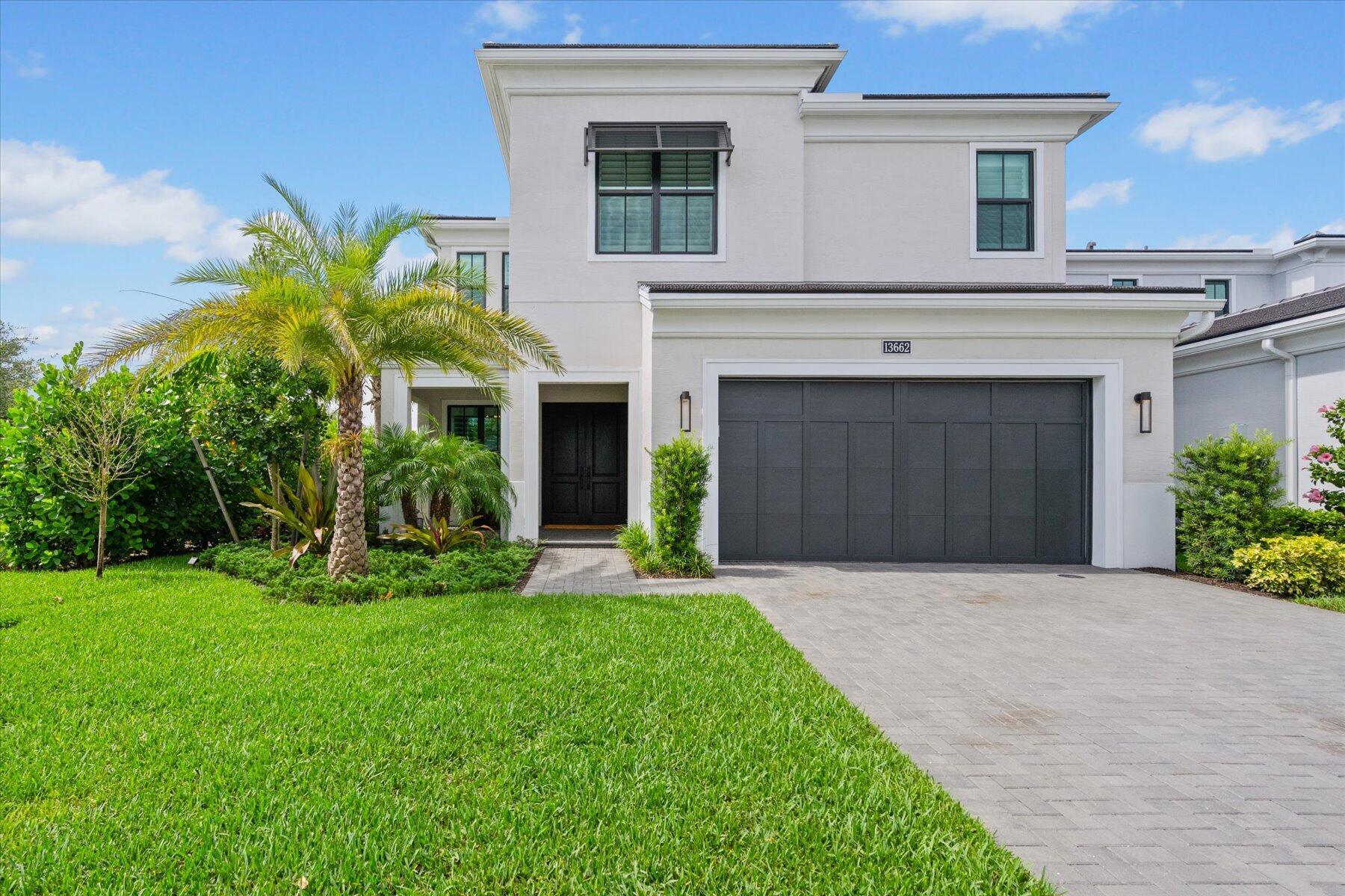 Modern luxury coastal living at its finest in this 2023 Hudson Model home in the premier community of Artistry in Palm Beach Gardens! Boasting southern exposure, situated on a corner lot, this 2-story high-efficiency home offers 4 bedrooms, a den/office, an upstairs loft, 3 full and 1 half bath, and a 2-car garage. The home is adorned with custom upgrades, including a solid mahogany double-door entry, upgraded sliders, an extended primary suite, wide oak wood flooring, custom stair railing, upgraded 2-tier cabinetry, custom closet organizers, designer wallpaper, and designer light fixtures. Additional features include plantation shutters on every window, square recessed lighting, high-efficiency AC, spray foam insulation and superb designer finishes throughout.