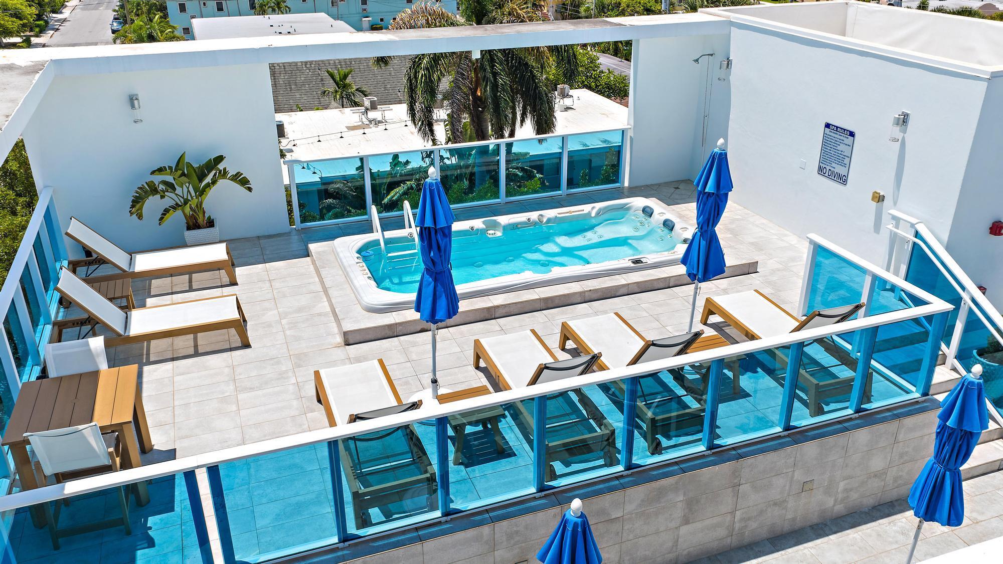 Modern Luxury Condo in the Heart of Lake Worth Beach. Experience boutique coastal living in this rarely available 2-bed/2-bath condo just minutes from the beach & downtown Lake Worth. Built in 2018, this light-filled home offers impact windows, wood-look flooring, 2 en-suite retreats, walk-in closets, spa-inspired baths, a soaking tub, & volume ceilings. The kitchen features sleek cabinetry, quartz countertops, stainless steel appliances, & a breakfast bar. Enjoy an expansive balcony, storage closet & gated parking. The exclusive 14-unit building offers a fob-access lobby, rooftop deck w/ swim spa, BBQ kitchen, & city views. Pet-friendly w/ flexible leasing. Refined coastal living close to the ocean, golf, tennis, Bryant Park, restaurants, & shops.