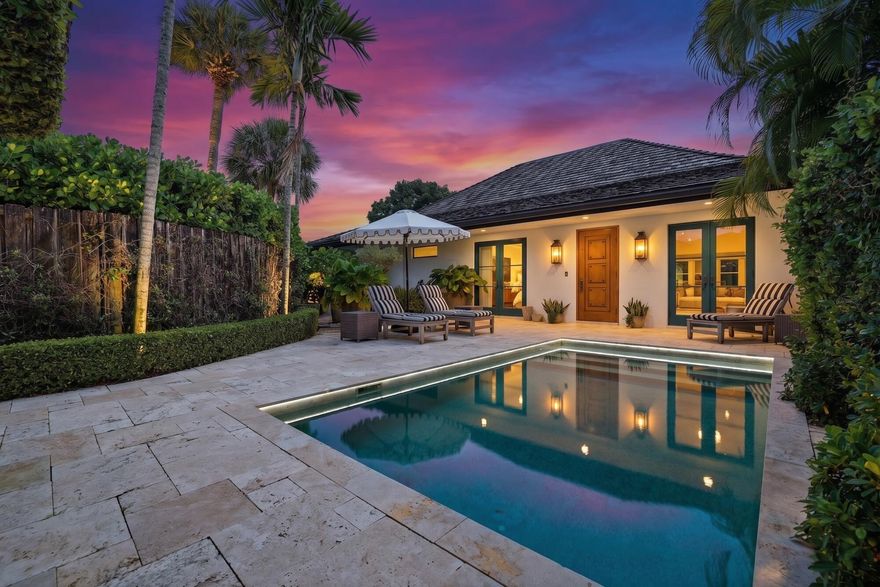 Stunning courtyard villa situated on an oversized lot in prestigious Palm Beach Polo & CC.. This exceptional home offers privacy & elegance featuring a private heated pool, garage, & serene water views. From the moment you enter, you're greeted by soaring vaulted wood-beam ceilings & exquisite marble flooring, creating a warm yet sophisticated atmosphere. The gourmet kitchen, complete with Sub-Zero refrigerator, high-end appliances, custom wood cabinetry, & charming apron-front sink. Designed for both everyday living & entertaining, the home boasts impact windows & French doors throughout, surround sound system, fresh exterior paint, & expansive screened, covered patio—ideal for entertaining. The spacious primary suite serves as a true retreat. Close to equestrian venues and shopping.  This home offers the best of luxury living in one of Wellington's most sought-after communities.