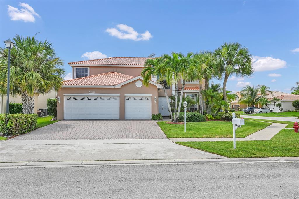 Immaculate Bal Harbor model in prestigious Boca Winds. This 4 bedroom, 2.5 bath home sits on an oversized fenced corner lot and features a screened patio. Fully hedged private back yard with plenty of room for a pool. Newly remodeled quartz kitchen counters and stainless steel appliances with eat-in area. Inviting grand foyer with high ceilings and a great floor plan for a family and entertaining friends. Large master bedroom with European style vanity. Beautiful bamboo wood floors throughout the upstairs and bedrooms. 3 car garage and accordion hurricane shutters. You can walk to highly desired ''A'' rated schools. The roof is from 2019 and the garage has AC. The community has 2 tennis courts, a basketball court and a beautiful pool with a clubhouse. This is a must-see