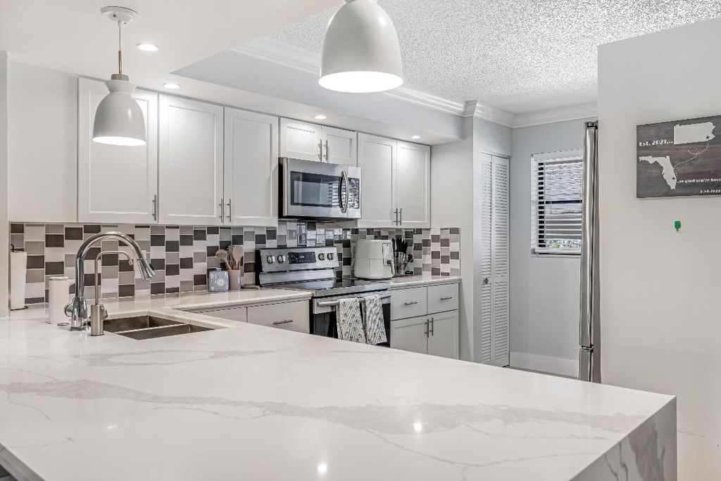 Photo of 12926 Briarlake Drive #201, Palm Beach Gardens, FL 33418 (MLS # R11079735)