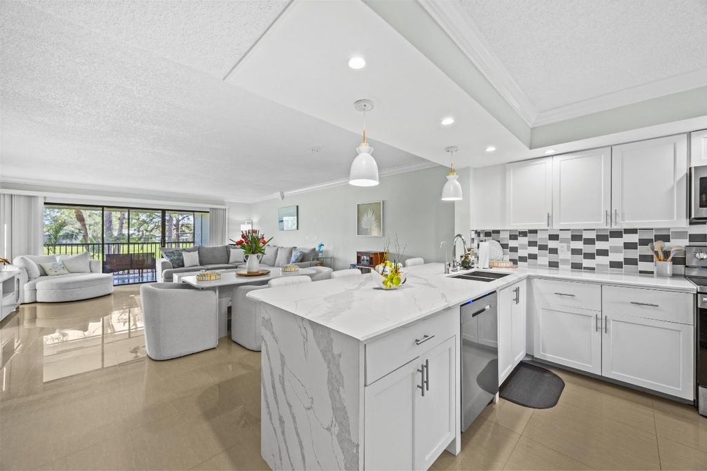 Photo of 12926 Briarlake Drive #201, Palm Beach Gardens, FL 33418 (MLS # R11079735)