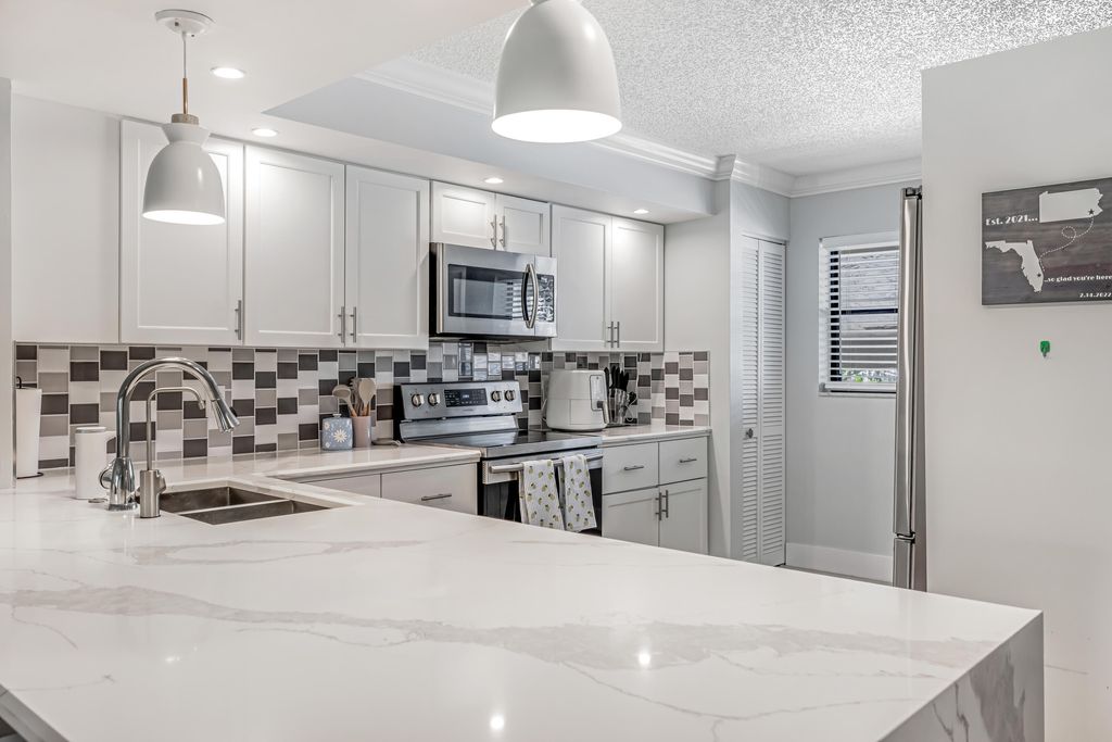 Photo of 12926 Briarlake Drive #201, Palm Beach Gardens, FL 33418 (MLS # R11079735)