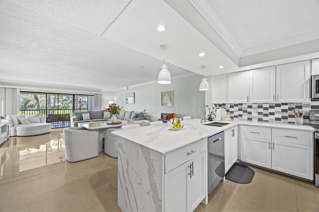 Photo of 12926 Briarlake Drive #201, Palm Beach Gardens, FL 33418 (MLS # R11079735)