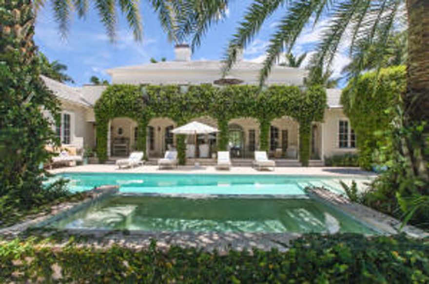 Nestled in the heart of Gulf Stream this elegant point lot estate home is situated on a rare 348” of water frontage. Opening graciously with astonishing views from the entire first floor, the home features five en-suite bedrooms, a grand European style kitchen with over-sized work stations, adjacent spacious family room with tongue and grove cathedral ceilings allowing for lots of natural light and wide water views.   The sprawling   ground floor master suite encompasses the east side of the home and features a spa like master bath complete with sitting room and bamboo enclosed outdoor shower. Additionally, there is a large guest suite on the main floor. The thoughtful separation of space affords a sense of comfort and privacy. The second floor offers three additional suites with a large multi-purpose room all opening to a balcony overlooking the water. The subdued colors of the interiors and refined finishes enhance the homes natural serenity allowing the sun-drenched interiors to flow seamlessly to an inspiring outdoor loggia and a tropical back yard paradise. Completing this fabulous offering, is an oversized pool with spa and dock to accommodate a large yacht. Simply put, this is the perfect setting for relaxing and entertaining at it's best.