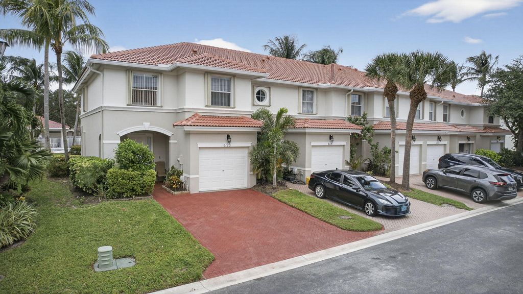 Photo of 6120 Seminole Gardens Circle, Riviera Beach, FL 33418 (MLS # R11130495)