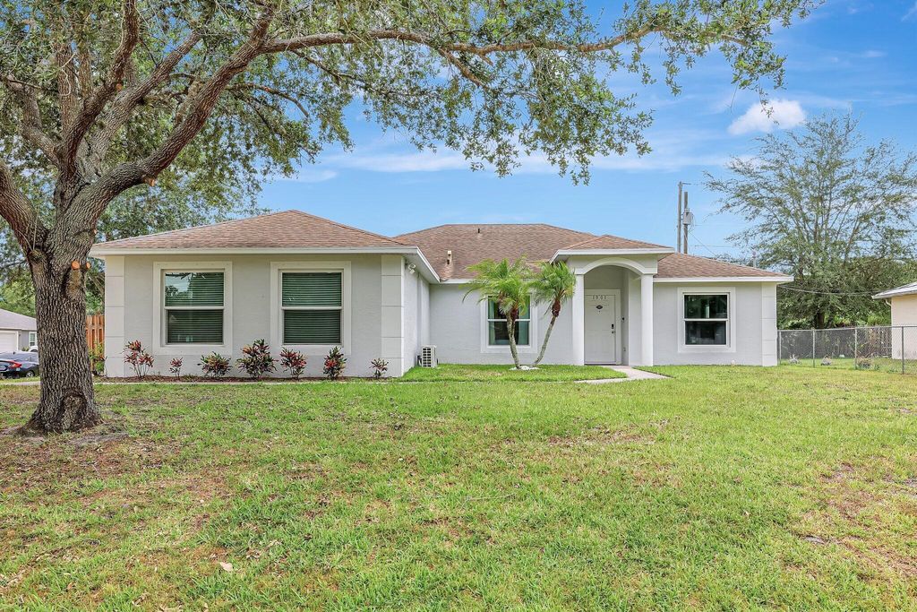 Photo of 1901 SW Aguero Street, Port Saint Lucie, FL 34953 (MLS # R10995903)