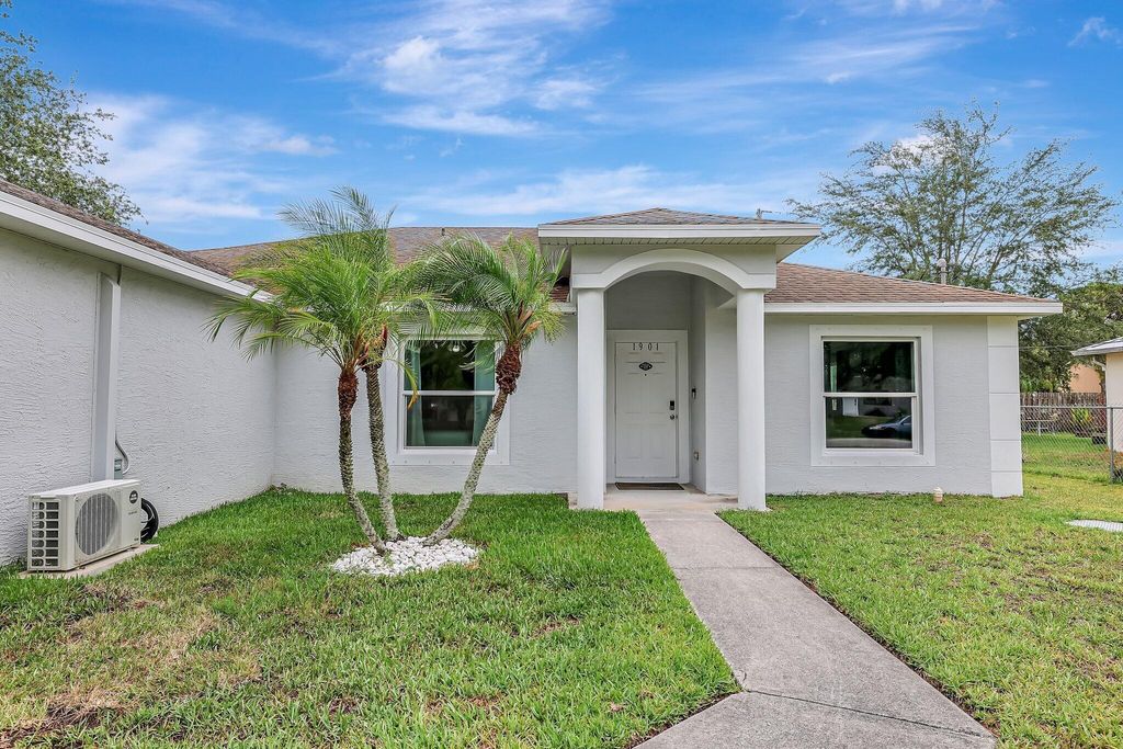 Photo of 1901 SW Aguero Street, Port Saint Lucie, FL 34953 (MLS # R10995903)