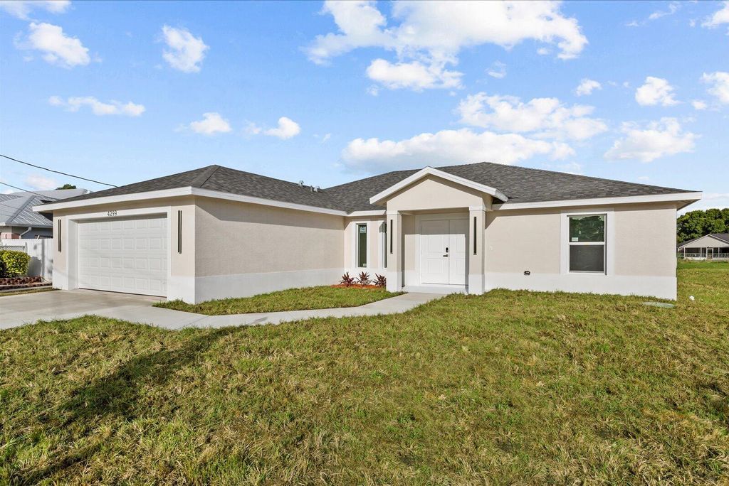 Photo of 4299 SW Hagaplan Street, Port Saint Lucie, FL 34953 (MLS # B26011252)