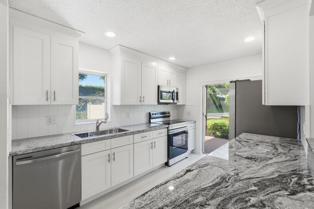 Photo of 8861 Echo Lane, Boca Raton, FL 33496 (MLS # B26075527)
