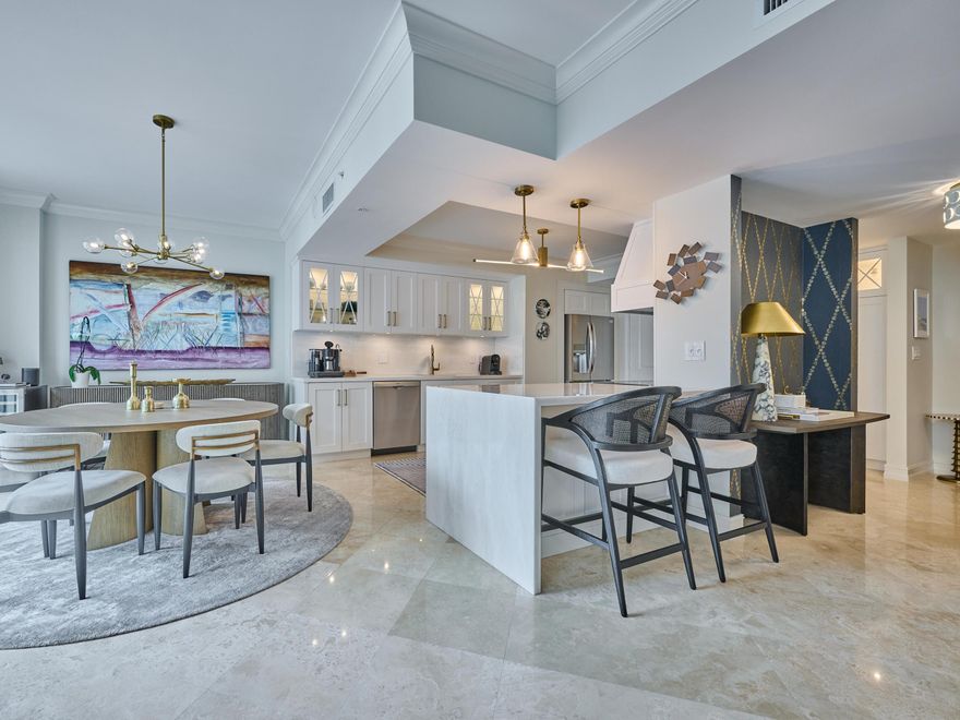 Rare opportunity to own a move-in-ready two-story penthouse in one of Boca's premier luxury buildings, just moments from Mizner Park, fine dining, fitness studios, and upscale shopping. Beautifully remodeled with designer finishes, this residence features Saturnia marble floors, floor-to-ceiling impact glass, custom lighting, electric shades, and new appliances. The chef's kitchen offers marble countertops and backsplash, custom pantry storage, and pull-out drawers throughout. Additional highlights include oversized custom walk-in closets, zoned A/C and hot water systems, and two private balconies. Residents enjoy resort-style amenities including a pool, spa, fitness center, valet, attended lobby, and 24-hour security.