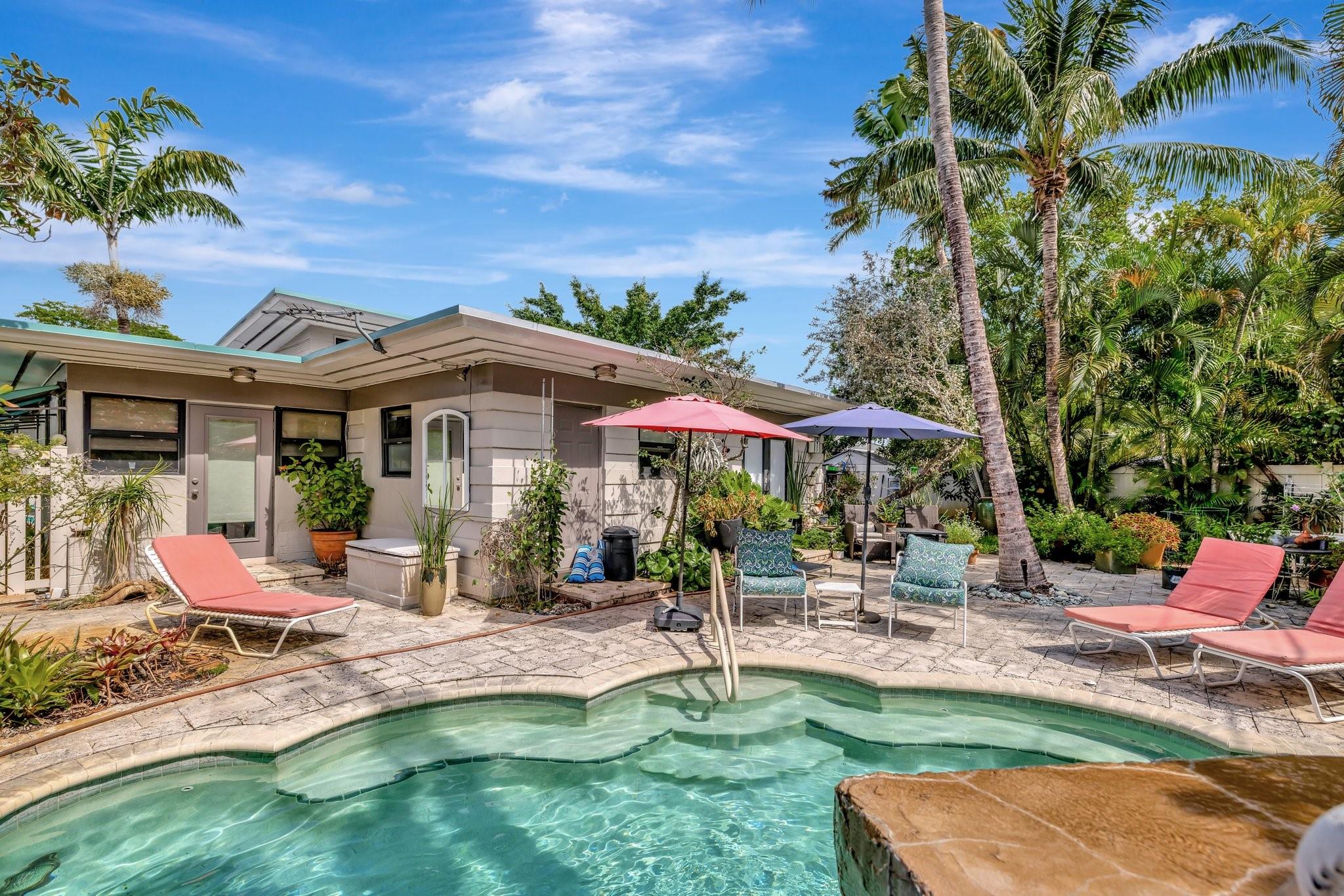 Discover an exceptional INVESTMENT OPPORTUNITY with this beautifully WELL MAINTAINED DUPLEX! Featuring two separate units. A 2 bed + den and 1.5 bath, the other with 2 bedrooms and 1 bath. Nestled in a secure, gated setting, it boasts a PRIVATE POOL, lush landscaping, and a fenced-in patio for serene outdoor living. Each unit enjoys spacious interiors, bright kitchens, PRIVATE ENTRANCES, HURRICANE IMPACT WINDOWS/DOORS and IN-UNIT WASHER AND DRYER. With 5 PARKING SPACES and a prime location near shopping area, beaches, Wilton Drive, and Las Olas, this duplex is perfect for living in one unit while renting the other, generating income with short or long-term rentals, or redeveloping into new luxury townhouses. A rare find in a sought-after area! COME AND VISIT IT TODAY!