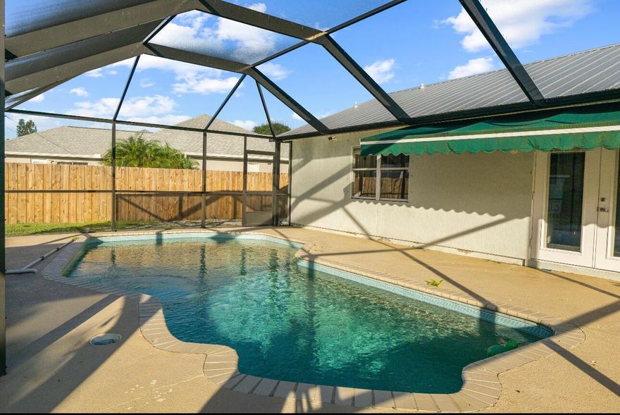Enjoy Your Own Private Screened Pool in This Beautiful Port Saint Lucie Home!This stunning single-family home offers the perfect blend of comfort and relaxation! The screened-in pool area is the centerpiece -- spacious enough to entertain family and friends or simply unwind in your private outdoor oasis.Inside, you'll find an updated kitchen with modern appliances and a bright open layout that makes this home truly inviting. The garage was professionally converted with permit, giving you the flexibility to use it as a 4th bedroom, family room, or office.📍 Conveniently located in Port Saint Lucie, close to shopping, dining, and major roads.🌴 Large backyard for outdoor activities.✨ Beautifully maintained and move-in ready!