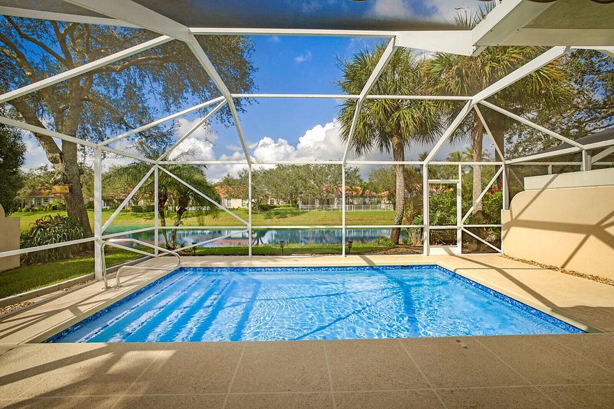 BE IN FOR THE HOLIDAYS! Spectacular Pool Home with RENOVATIONS/UPGRADES on Beautiful Water Lot in Premier RiverWalk Community with NEW ROOF in 2024! Tranquil water views from this gorgeous ''light & bright'' Capri Model vaulted ceilings & Covered Patio/Domed Screened Pool - Ideal to enjoy the outdoor South Florida lifestyle.  A magnificent Master/Primary Suite with walk-in closets with built-ins, plantation shutters, wood laminate floors, & a fully renovated Master Bathroom that will amaze you! The Owner did not stop there: Air conditioned Garage with new Epoxy professionally finished floor; tankless water heater; newly refinished pool & enclosure, hurricane impact entry door, updated alarm system with cameras, hi-hat lighting &  more! Quick closing available/See Supplement
