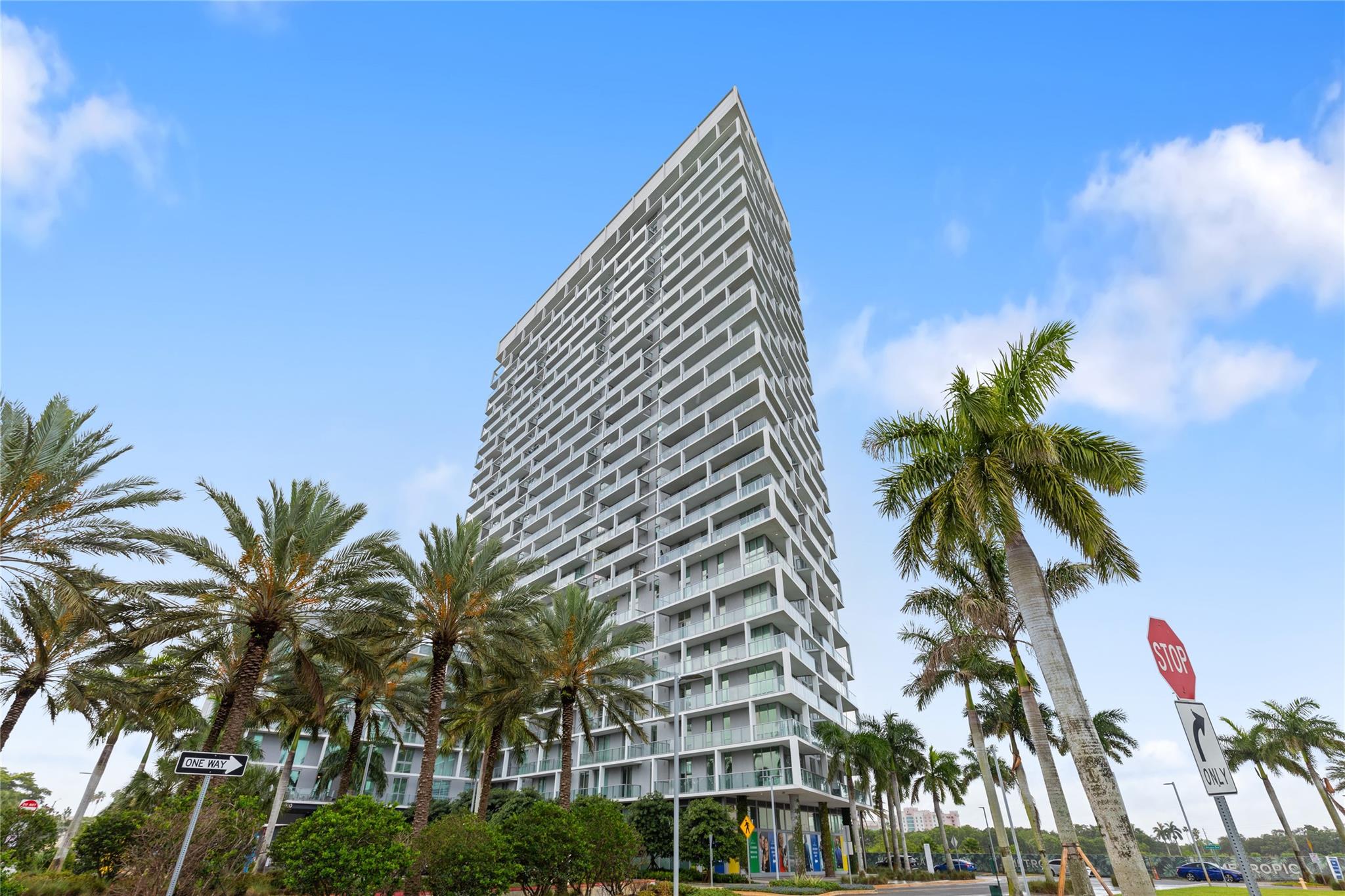 Welcome to this modern 2 bed, 2 bath condo at brand-new One Metropica. Enjoy a spacious layout with porcelain tile floors, floor-to-ceiling impact windows, and a large balcony with unobstructed views through glass railings. The open kitchen features top of the line appliances, Italian cabinetry with serene outdoor views. Resort style amenities include a stunning lobby, expansive pool and spa, state-of-the-art gym, club room, business center, and playroom. Ideally located next to Sawgrass Mills Mall and just 20 minutes from Fort Lauderdale Airport and Port Everglades.