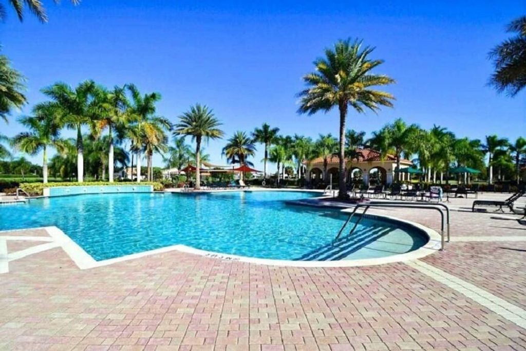 Photo of 393 NW Breezy Point Loop, Port Saint Lucie, FL 34986 (MLS # R11004683)