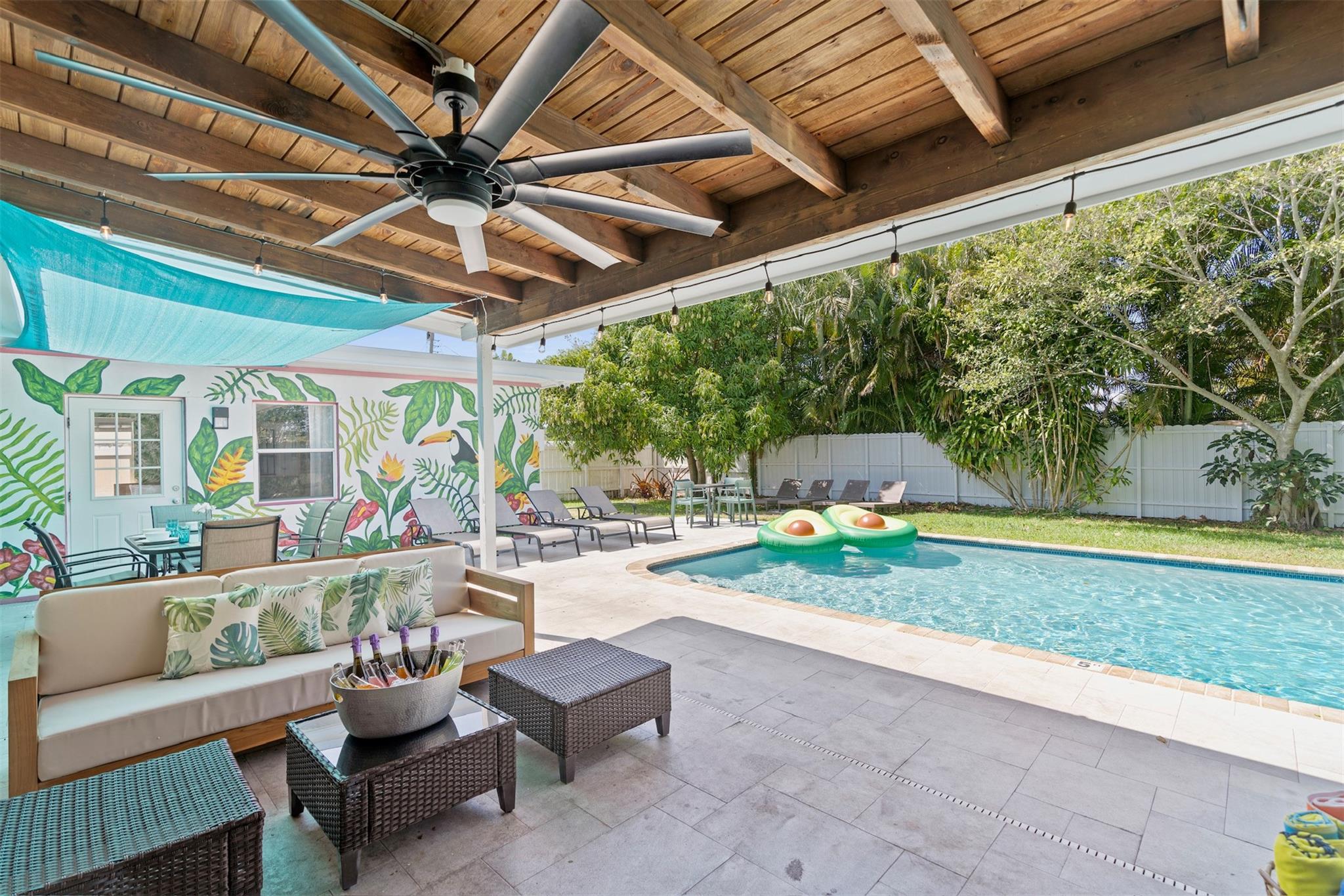 Luxury Seasonal Rental available January - April 2026. Spend your winter in paradise! This tastefully furnished 4-bedroom, 2-bath home offers a perfect blend of comfort and coastal living. Step into a spacious open floor plan, decorated to be modern and beachy. Upgraded kitchen and baths, vinyl flooring, three 70" TV's, walk-in closet, indoor laundry room. Enjoy the best of outdoor living with a newly resurfaced Pool, covered outdoor patio + TV, outdoor shower, BBQ, and large grassy area. Perfect for entertaining or relaxing in your own tropical oasis. Fully equipped with all the bells and whistles needed for a comfortable seasonal stay. Just minutes to beaches, dining, shopping, golf, and more. All utilities and maintenance included in rent. Pets welcome. Your seasonal retreat awaits!