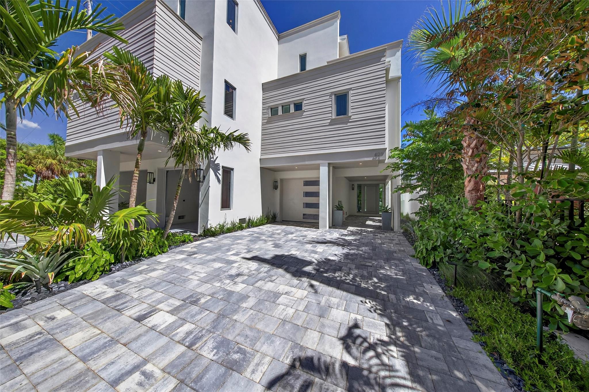 RARE OPPORTUNITY TO OWN A STUNNING 3-STORY MASTERPIECE ON FT. LAUDERDALES ICONIC NEW RIVER, COMPLETE W/ A NEW SEAWALL & 70’ FLOATING DOCK!! A DRAMATIC, FULL HEIGHT GLASS STAIRCASE, IMPORTED SIBERIAN OAK FLOORS, INTERIOR ATRIUM, & CUSTOM RECLAIMED BARNWOOD CEILING BEAMS SET IT APART! ITALIAN CHEF’S KITCHEN W/ 48” GAS RANGE, 3" CALACATTA MARBLE COUNTERTOPS & OVEN HOOD, & PANELED APPLIANCES WILL AMAZE! EACH BEDROOM OFFERS AN EN SUITE BATHROOM & PRIVATE BALCONY W/ RICH IPE DECKING, WHILE THE SPA-QUALITY PRIMARY BATHROOM CREATES A SANCTUARY OF LUXURY & RELAXATION! 10’ CEILINGS, (2) BUILT IN BBQ’S, LUSH TROPICAL LANDSCAPING, PEBBLE-TEC POOL/SPA, & A PRIVATE ELEVATOR LEADING TO A ROOFTOP W/ SUMMER KITCHEN & PANORAMIC VIEWS OF THE RIVER, CITY SKYLINE, AND MARINAS BELOW MAKE THIS A PERFECT "10"!