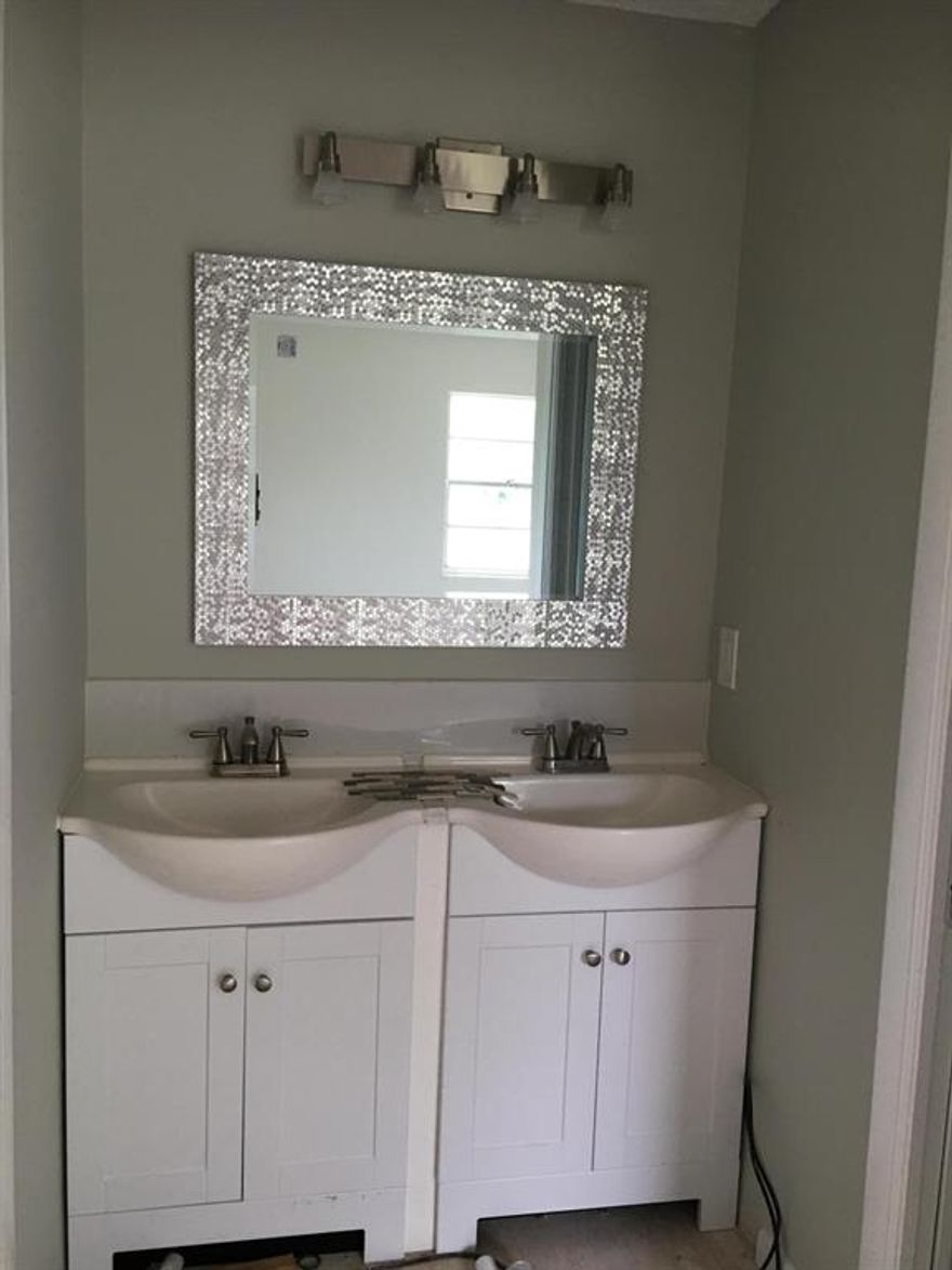 Be the first to live in this newly renovated home with designer tile floors throughout. Spacious living/ dining ideal for large families or hanging with friends. The kitchen boasts new wood cupboards, soft close drawers, granite counters, farm sink and stainless steel appliances. 
Neutral colors with high ceilings and brushed nickel modern lighting fixtures. All new bathrooms with modern elegant accessories. Washer dryer hookup.
Fenced backyard and side yard w/ three assigned parking.
Located in the heart of Pleasant City near N Flagler Drive, Walk or bike to Historic Northwood Road district w/ shops, restaurants,emerging charm and quaint atmosphere.A heartbeat away from City Place and downtown waterfront.