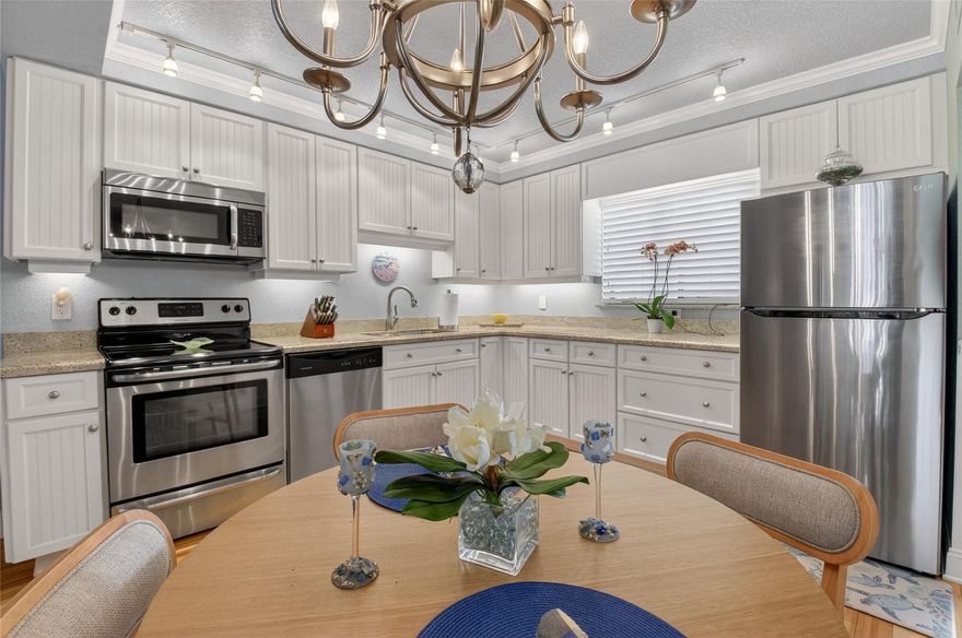 Dive into your ready-to-relax coastal haven in sunny Delray Beach, Florida! This stylish corner condo boasts 2 cozy bedrooms, 2 baths, and a fully revamped open kitchen with chic craftsman cabinets. Ambient lights dance across the living and dining areas on sleek bamboo floors, while a roomy screened balcony invites breezy lounging. Toss in an in-unit washer/dryer and a serene lake view from the second bedroom for ultimate ease. As part of a vibrant 55+ community, splash in the pool, mingle at the clubhouse, sweat in the fitness room, or stroll the lakeside path. Minutes from cinemas, shops, eateries, and lively Downtown Atlantic Avenue. Pack a handbag and make it your vacation escape—keys await!