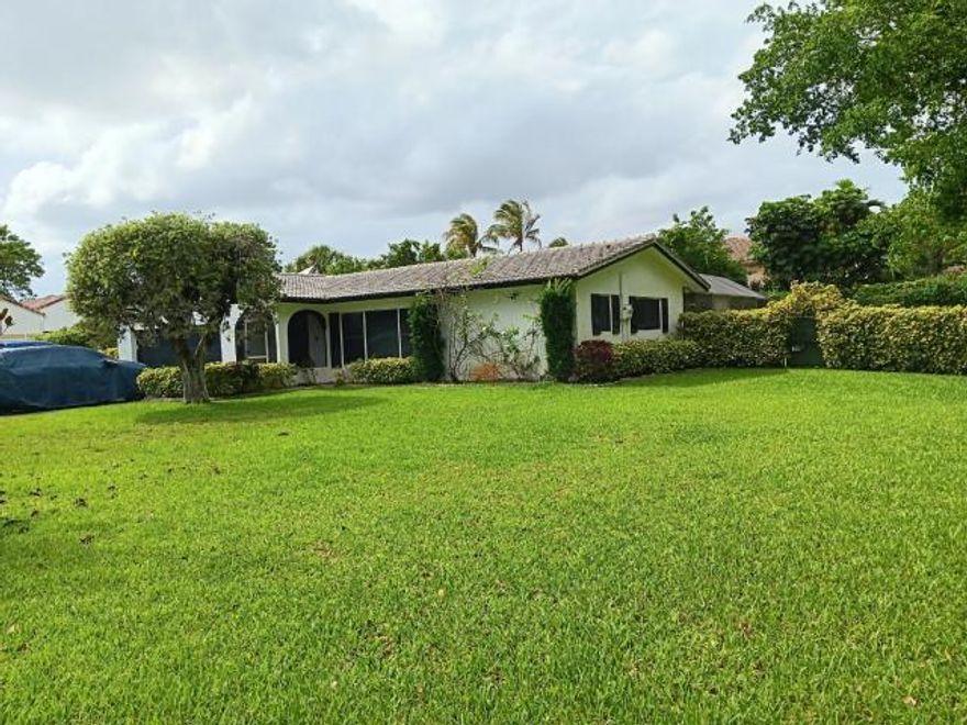 Auction Opportunity in Established Coral Springs Neighborhood! Located on an oversized lot in the desirable Coral Springs Country Club area, this 4-bedroom, 2-bath pool home offers excellent potential for investors or buyers looking to renovate and customize. Built in 1973, the property features a spacious layout, 2-car garage, and a large backyard with private pool. Situated in a well-established community known for its tree-lined streets, generous lot sizes, and no mandatory HOA, residents enjoy flexibility and a true neighborhood feel. Conveniently located near major roadways, shopping, dining, parks, and schools. Property is being sold via auction platform. Interior access is not available—buyer to perform all due diligence. Great opportunity to add value in a sought-after Coral Spring
