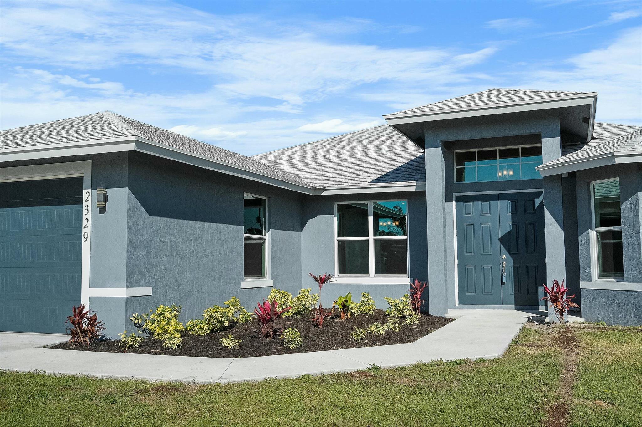 Experience luxury living in this 2023 CBS-built masterpiece in Port St. Lucie. With 4 beds, 3 baths, and 10 ft doors, this home exudes modern elegance. Unwind in style with a charming claw foot tub in the owners suite bathroom. Designed with safety in mind, property is fully fenced and all windows/doors are impact and hurricane-rated. Enjoy outdoor entertaining with a large covered patio with an opportunity for a summer kitchen, blending convenience with style. Don't miss this chance for new construction excellence in a prime location.