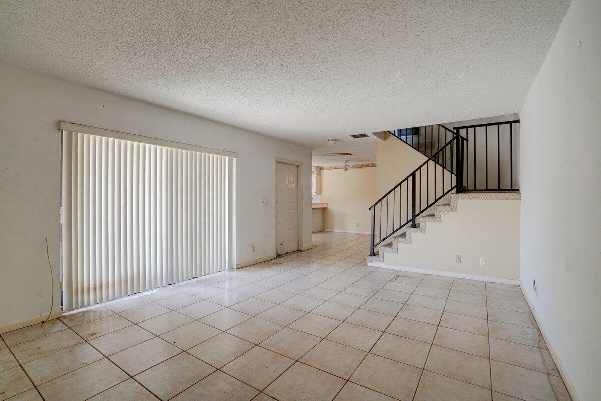 Investors & Opportunity Seekers - This One Breaks All the Rules! Yes - you can rent immediately and multiple times per year. Yes - pets welcome with no restrictions. Tucked into one of East Delray's best-kept secrets, this private corner-unit townhome features a huge enclosed patio - your own tranquil outdoor retreat. Inside, discover two spacious upstairs bedrooms with Juliet balconies, oversized closets, and serious potential. Major improvements already handled: NEW Roof (2024) and NEW Electrical Panel (2023).Low HOA includes insurance! All ages welcome. East of I-95 and minutes to the beach, Whole Foods, Target, and downtown Delray. Flip it, rent it, or make it your own. Priced AS-IS to move fast - schedule your showing today!