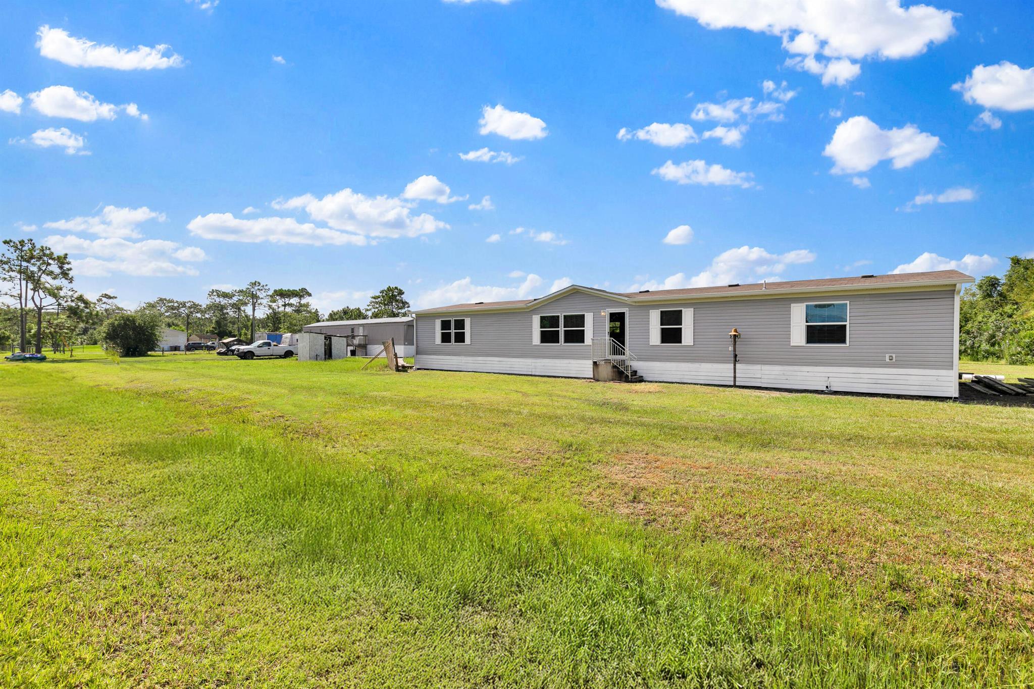 2 Homes on 1.3 Acres. Primary Home built in 2023- 5 Bed 3 Bath, Guest Home 3 Bed 2 Bath. No deed restrictions. Perfect for a multi-generational family household, Income producing rental or Air B&B. 1 hour Drive to Disney & Melbourne Beach. Easy access to amenities.