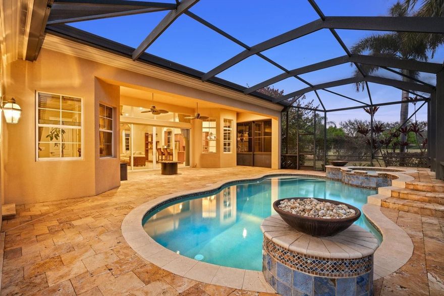 One of the LARGEST and most PRIVATE lots in PGA Verano — a rare opportunity for SPACE, PRIVACY, and resort style living. Move-in ready with major upgrades including a barrel tile roof (Feb 2026, transferable warranty) and a new AC system installed in 2025. Inside, soaring 12-FOOT CEILINGS with crown molding highlight bright open living spaces that flow through expansive sliding doors to a private outdoor retreat. The kitchen features custom cabinetry, new appliances, a spacious walk-in pantry, and reverse osmosis water filtration. The primary suite offers two full bathrooms and dual oversized walk-in closets. Enjoy a heated saltwater pool and spa surrounded by travertine. Guard-gated security and resort pools, tennis courts, walking trails, fitness center, e-gym and 27 pickleball courts.