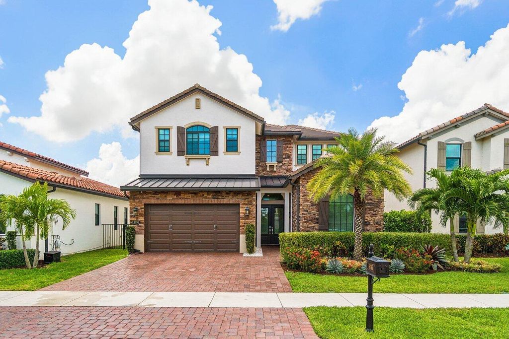 Photo of 8795 Grand Prix Lane, Boynton Beach, FL 33472 (MLS # B26029925)