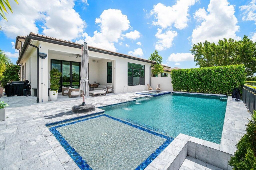 Photo of 8795 Grand Prix Lane, Boynton Beach, FL 33472 (MLS # B26029925)