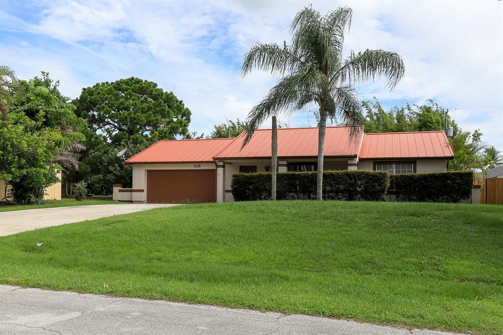 Photo of 113 SW Evans Avenue, Port Saint Lucie, FL 34984 (MLS # R10819625)