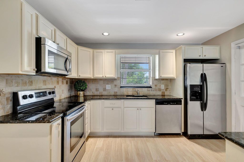 Photo of 10789 N Military Trail #6, Palm Beach Gardens, FL 33410 (MLS # R11017068)