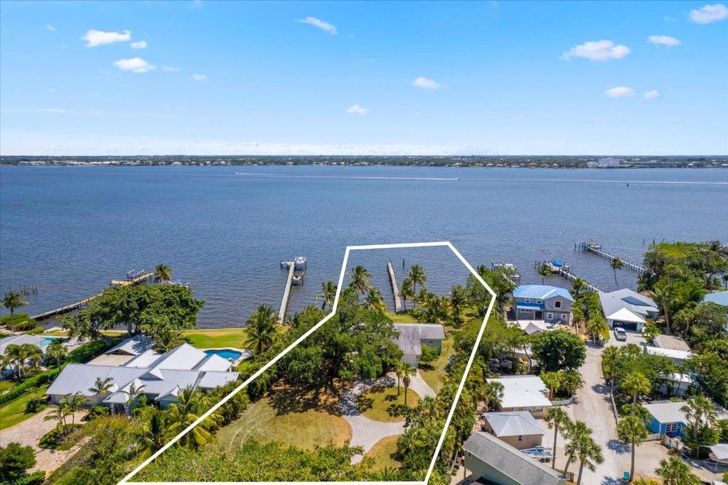 Photo of 850 NE Ixora Drive, Jensen Beach, FL 34957 (MLS # R10995031)