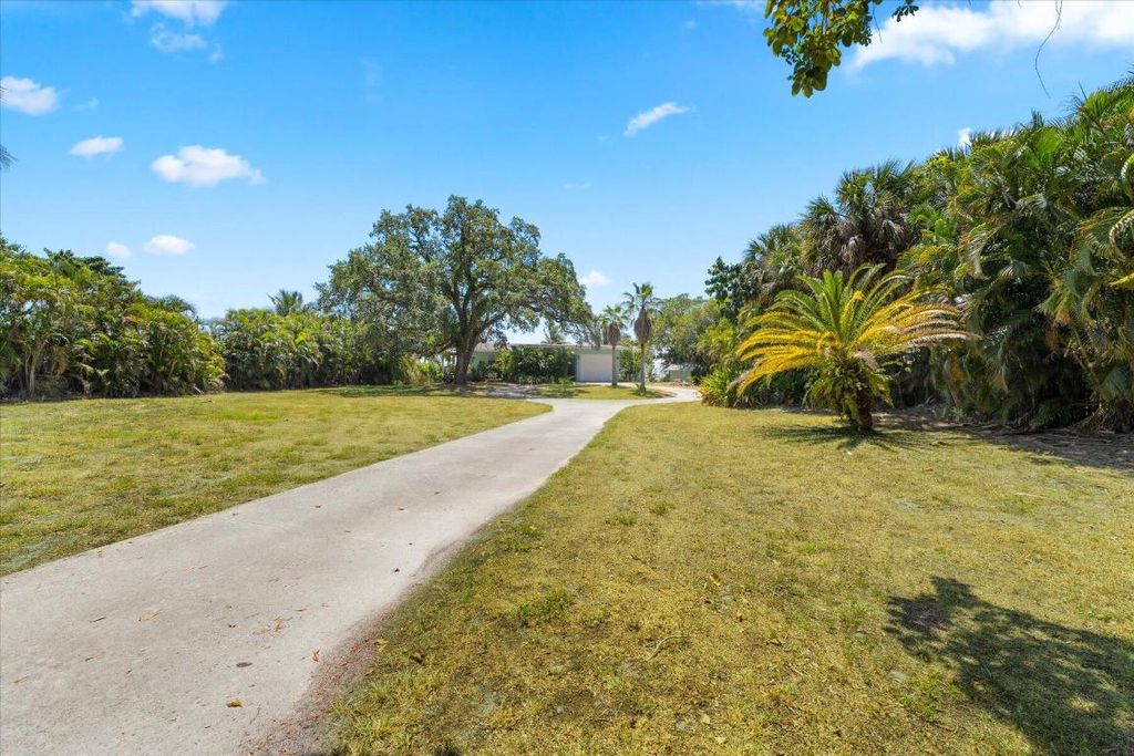 Photo of 850 NE Ixora Drive, Jensen Beach, FL 34957 (MLS # R10995031)
