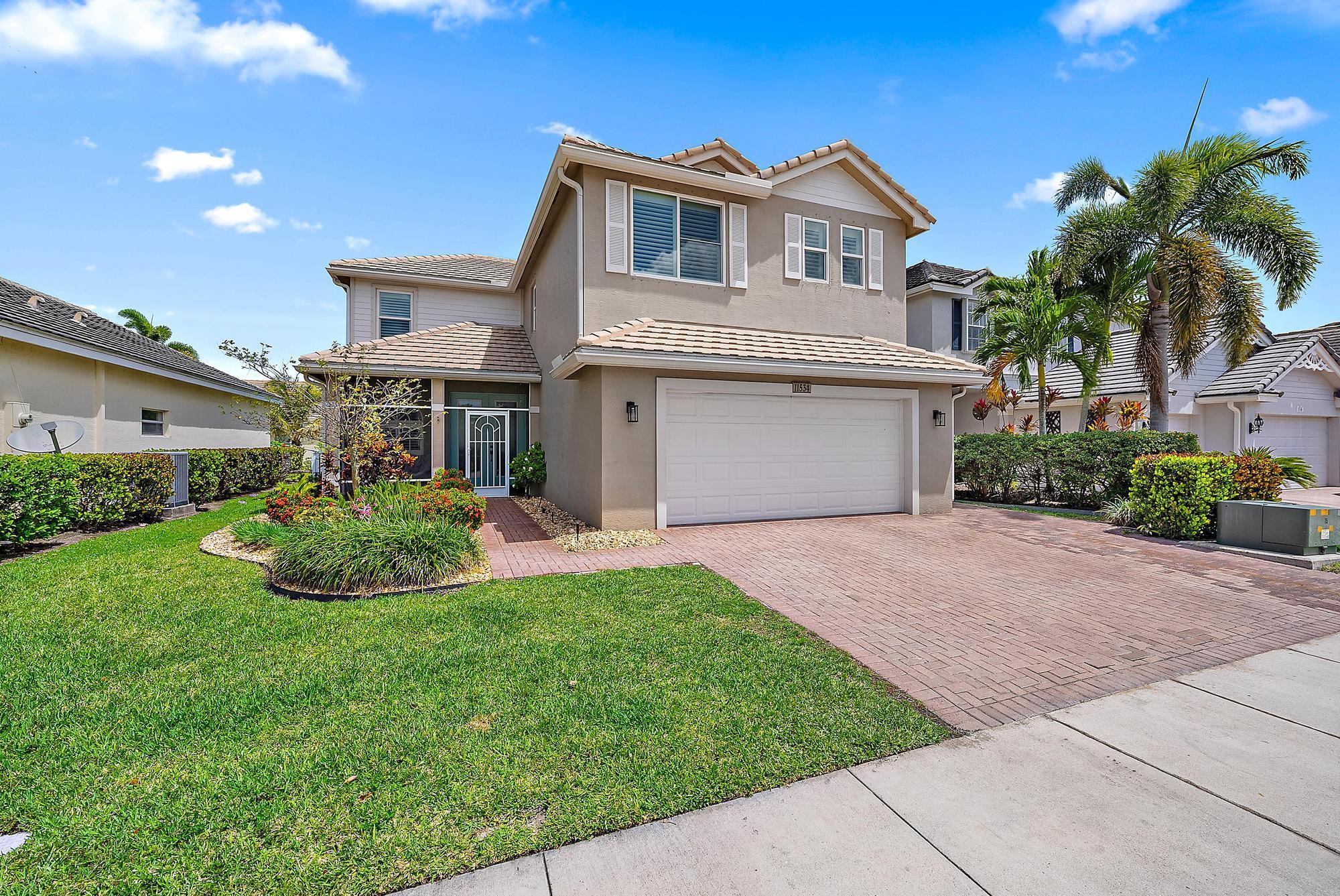 Don't miss this beautifully updated lakefront home in the gated community of Victoria Parc Estates featuring 3 bedrooms, 2.1 baths, a first-floor den/playroom, and a large upstairs flex space which could be a living room, office, gym, playroom - you name it! Enjoy a private backyard oasis with a saltwater pool, tropical landscaping, and stunning wide water lake views. Inside, enjoy an open layout with modern finishes, light-filled living areas, and versatile spaces perfect for work or play. Residents of Victoria Parc enjoy walkable parks, trails, shopping, dining, and tons of community events. Experience the lifestyle and convenience of Tradition living!