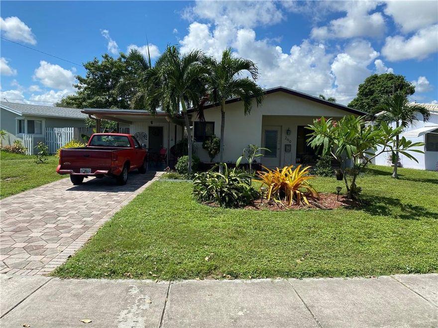 Corner Lot with fenced in back yard. New roof installed 2020 ,Carport Freshly painted and with New Roof  .Laundry Room and Tankless Water Heater .Large open Kitchen with Concrete Counter Tops and  Plenty of Cabinets.Impact Windows and Travertine Marble Floors .Bathroom with Stone Shower .Ready for you to View !!