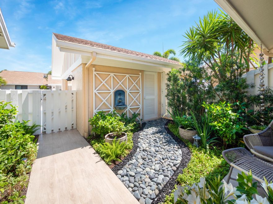 Immaculate completely remodeled end unit on an oversized corner lot in Jonathans Landing.  Full of natural light with vaulted shiplap ceilings, new hurricane impact windows and doors, A/C, porcelain plank tile floors, Bosch Appliances, quartz counter tops!  Tranquil tropical landscaped with three outdoor areas: front Zen garden, side  Conversation or possible fire pit area and a large private back yard.  Pull out cabinetry in kitchen, Built in closets, New Electric Vehicle charge, 3 outdoor storage areas for bikes, paddle boards etc.  Synthetic turf front and back for less maintenance. There is simply nothing like this - No stone left unturned!  It's truly a must see. Perfect location for your forever home, winter paradise or rental.  Close to beach & Everything else! Don't miss the video Don't miss the video tours of this home, Jupiter and Jonathan's Landing.  Memberships available but not required.  Showings will begin with First Looks on 6/4/2022 1pm -2:30pm  - Agents must accompany clients and schedule online or contact listing agent for gate access.