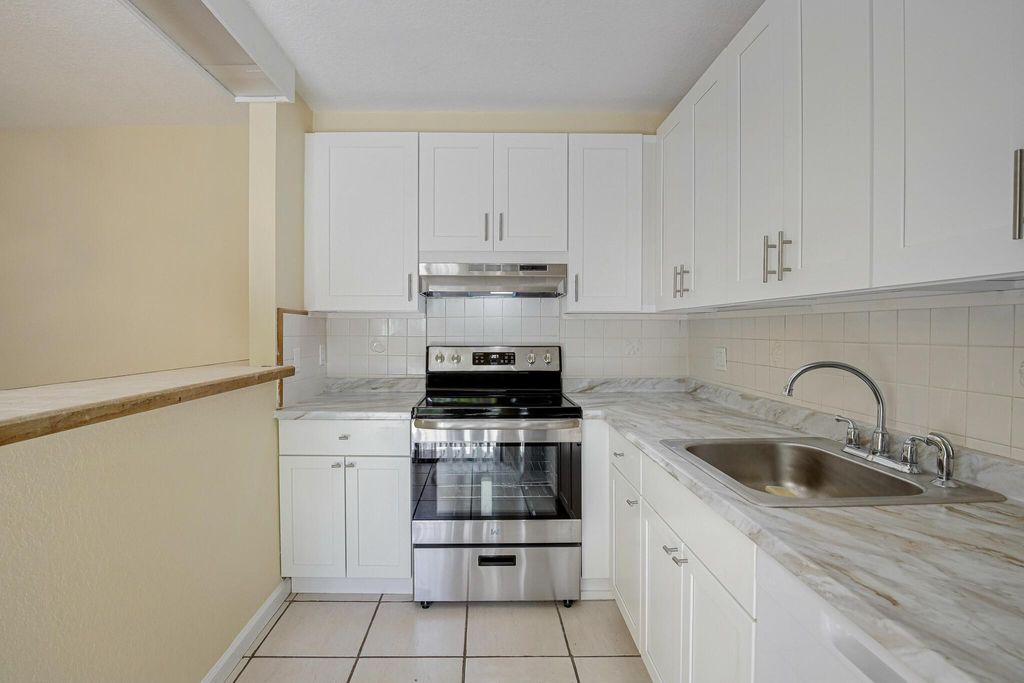 Photo of 145 Lake Arbor Drive, Palm Springs, FL 33461 (MLS # R11004438)