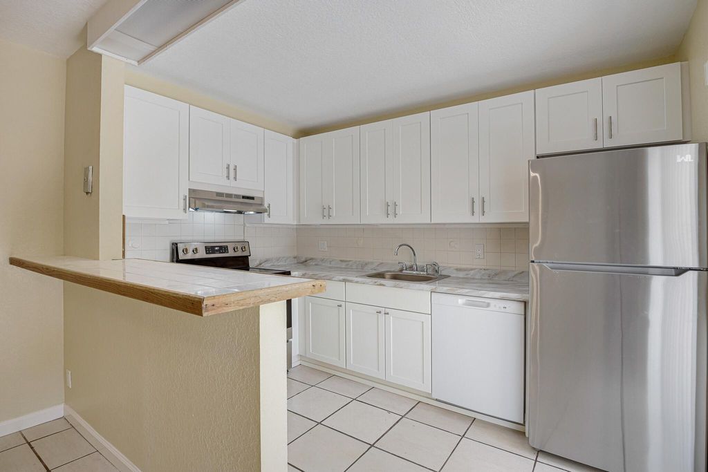 Photo of 145 Lake Arbor Drive, Palm Springs, FL 33461 (MLS # R11004438)
