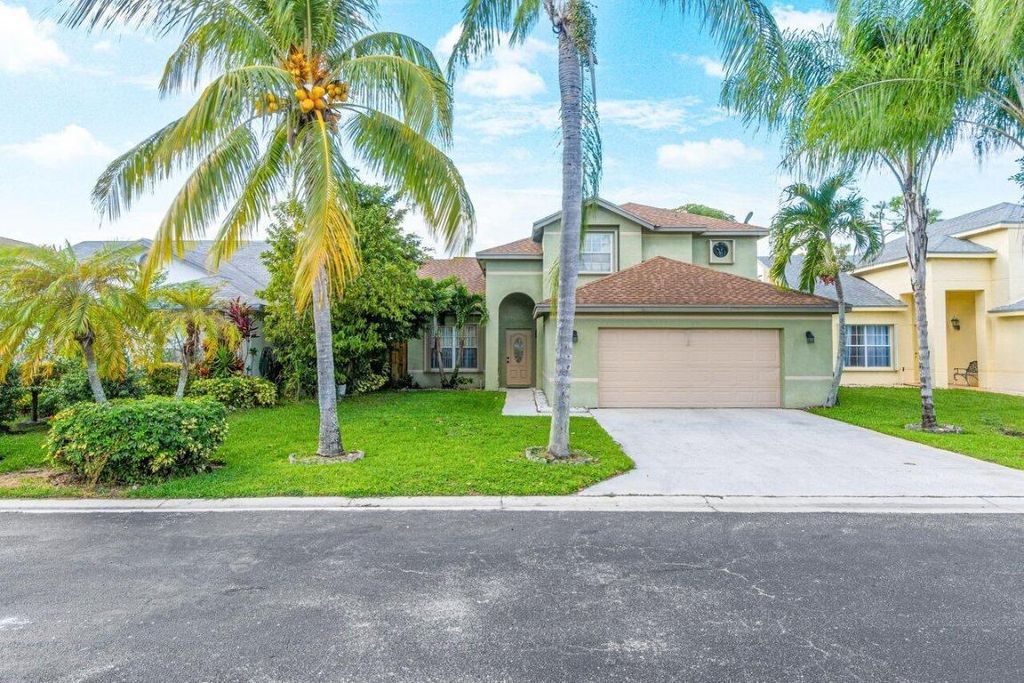 Photo of 110 Cypress Lane, Royal Palm Beach, FL 33411 (MLS # R10933306)