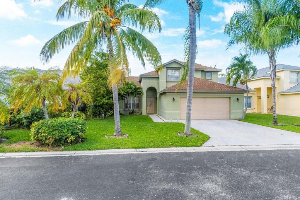 Photo of 110 Cypress Lane, Royal Palm Beach, FL 33411 (MLS # R10933306)