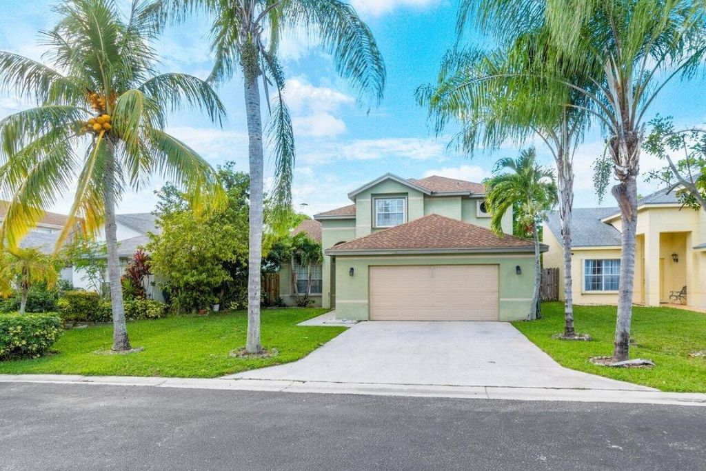 Photo of 110 Cypress Lane, Royal Palm Beach, FL 33411 (MLS # R10933306)